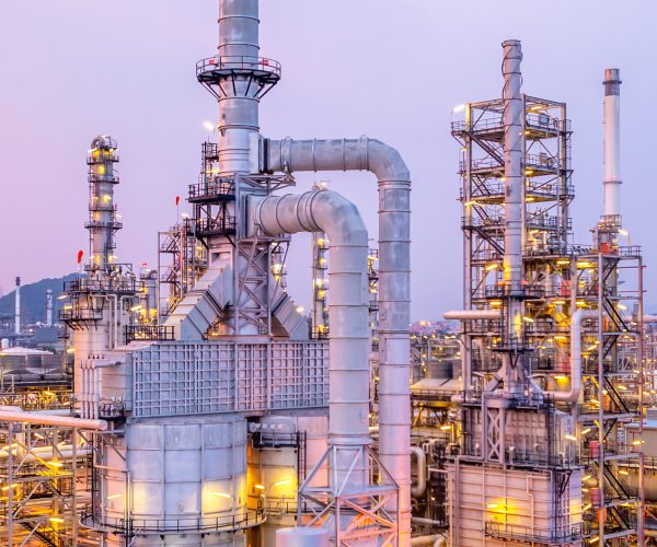 Aerial view oil and gas refinery plant at night, Global business energy logistic transportation, Oil and gas refinery petrochemical industrial, Petrochemical refinery industrial energy supply chain.