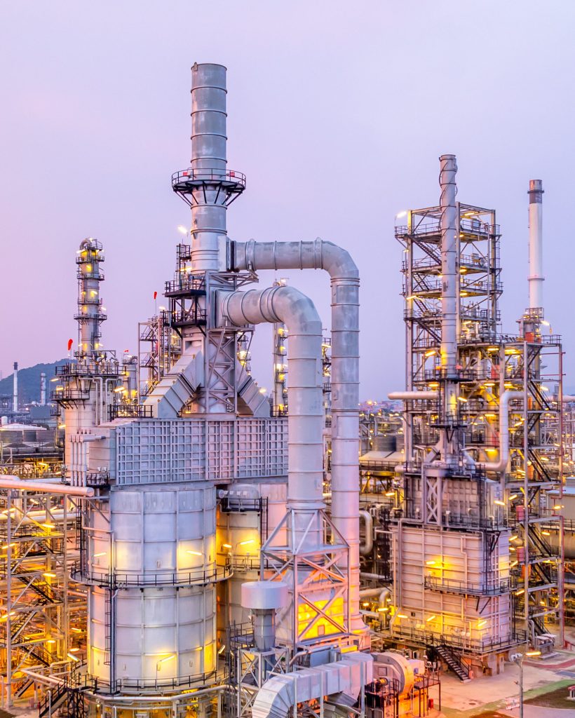 Aerial view oil and gas refinery plant at night, Global business energy logistic transportation, Oil and gas refinery petrochemical industrial, Petrochemical refinery industrial energy supply chain.