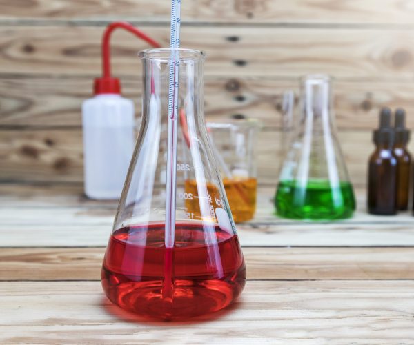 Beaker and bottle. Several chemical solution in flask. Laboratory glassware