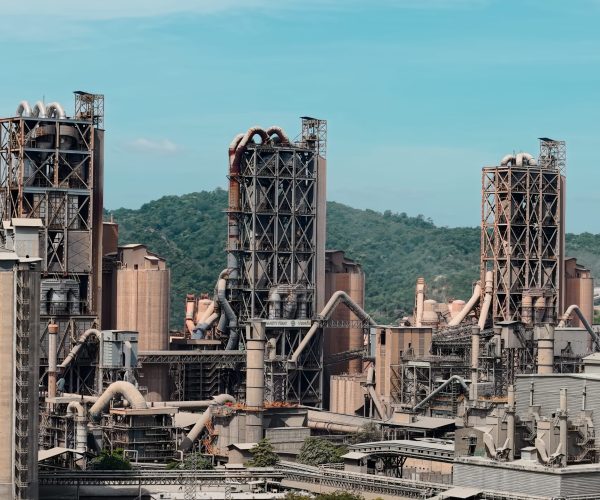 cement-factory-operating-against-green-hills-near-2026-01-12-05-49-44-utc